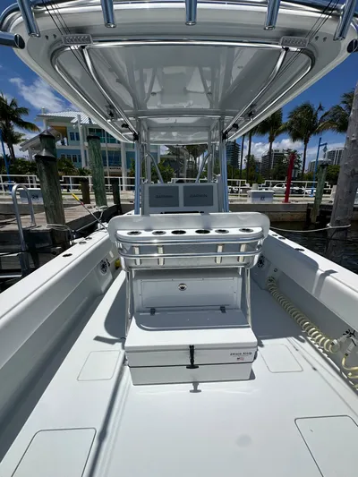  Yacht Photos Pics 2025 Contender 30 T boat interior with seating and console, docked at marina.