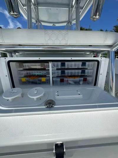  Yacht Photos Pics 2025 Contender 30 T boat with organized storage compartments and sleek design.