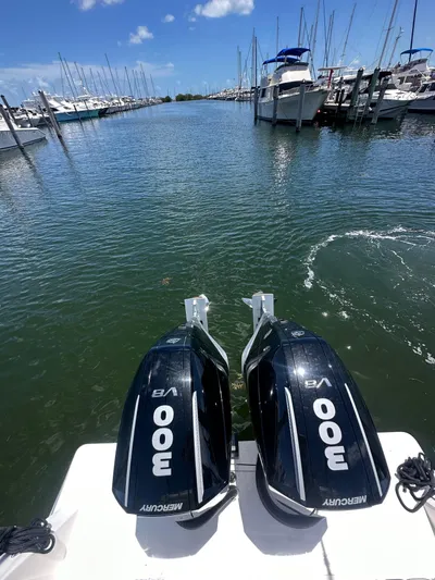  Yacht Photos Pics Twin Mercury 300 V8 engines on a 2025 Contender 30 T boat in a marina.