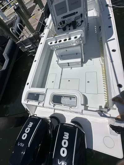  Yacht Photos Pics 2025 Contender 30 T boat with dual 300 HP engines docked at marina.