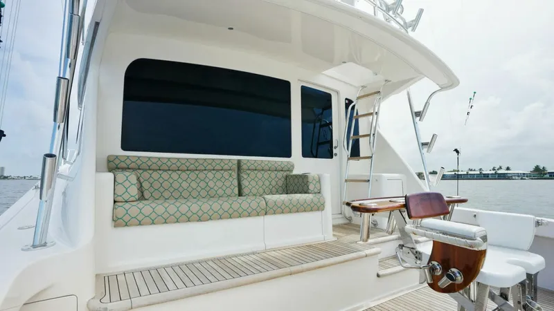 True Grit Yacht Photos Pics 2006 Viking 56 Convertible yacht deck with seating and fishing chair.