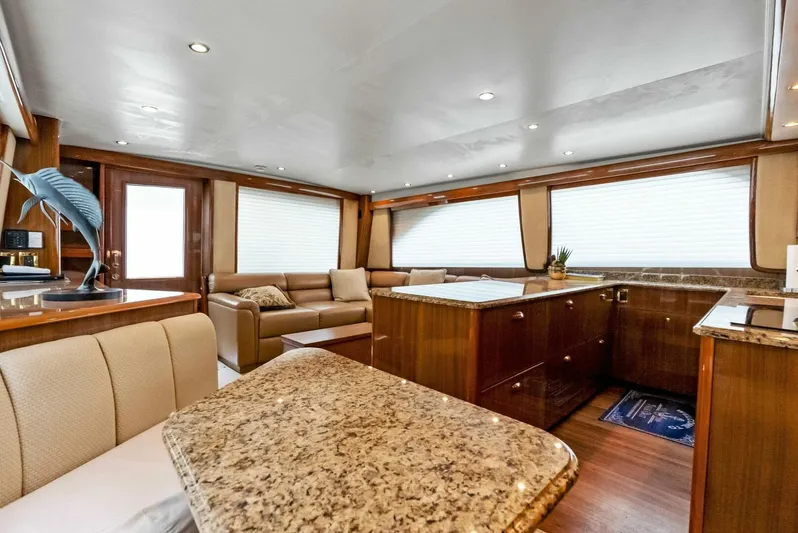 True Grit Yacht Photos Pics Luxurious interior of 2006 Viking 56 Convertible yacht with elegant wood and granite finishes.