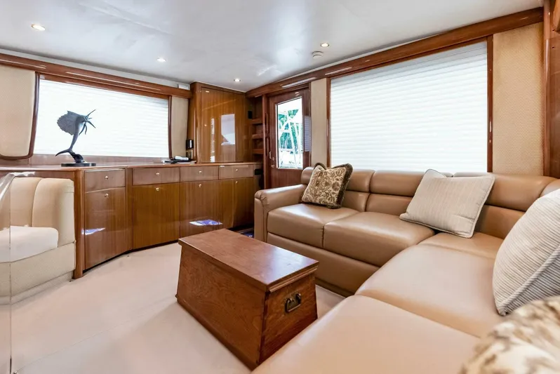 True Grit Yacht Photos Pics Luxurious interior of 2006 Viking 56 Convertible yacht with leather seating and wooden accents.