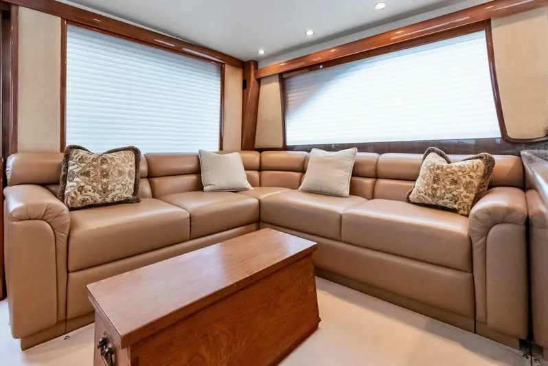 True Grit Yacht Photos Pics Luxurious interior of 2006 Viking 56 Convertible yacht with plush seating and elegant decor.