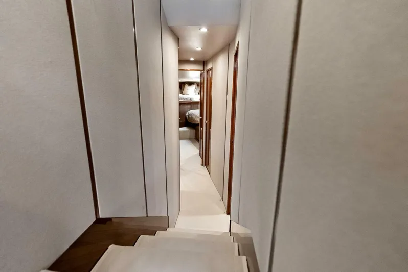 True Grit Yacht Photos Pics Interior hallway of 2006 Viking 56 Convertible yacht, featuring modern design and lighting.