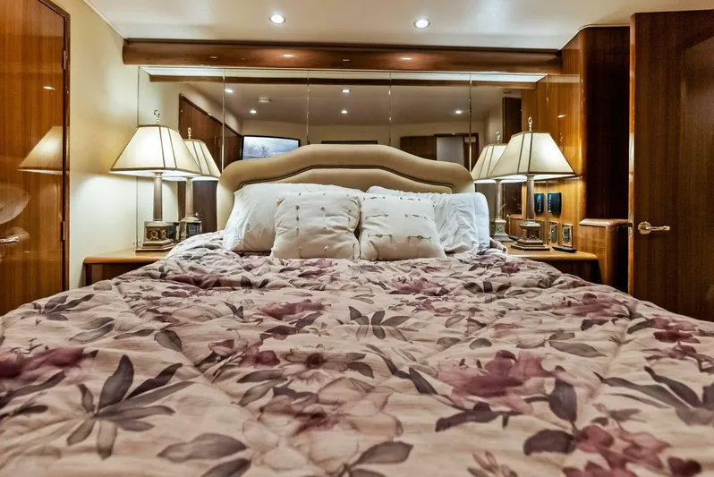 True Grit Yacht Photos Pics Luxurious bedroom interior of 2006 Viking 56 Convertible yacht with floral bedding.