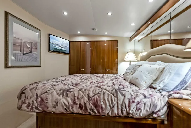 True Grit Yacht Photos Pics Luxurious bedroom interior of 2006 Viking 56 Convertible yacht with elegant decor.