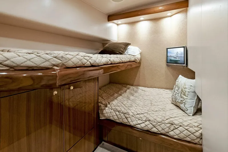 True Grit Yacht Photos Pics Cozy cabin interior of 2006 Viking 56 Convertible yacht with bunk beds.