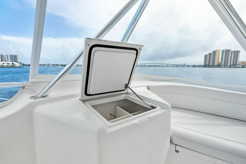 True Grit Yacht Photos Pics 2006 Viking 56 Convertible yacht interior with open storage compartment, ocean view.