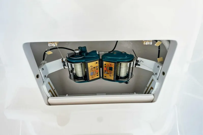 True Grit Yacht Photos Pics Viking 56 Convertible 2006 boat component, featuring dual electric reels in a compartment.