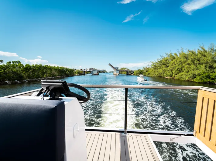  Yacht Photos Pics 2024 Navisyo Homes 28' NAVIS V.08 cruising on a sunny river with open bridge.