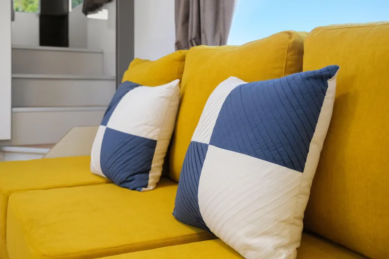  Yacht Photos Pics Yellow sofa with blue and white pillows in 2024 Navisyo Homes 28' NAVIS V.08.