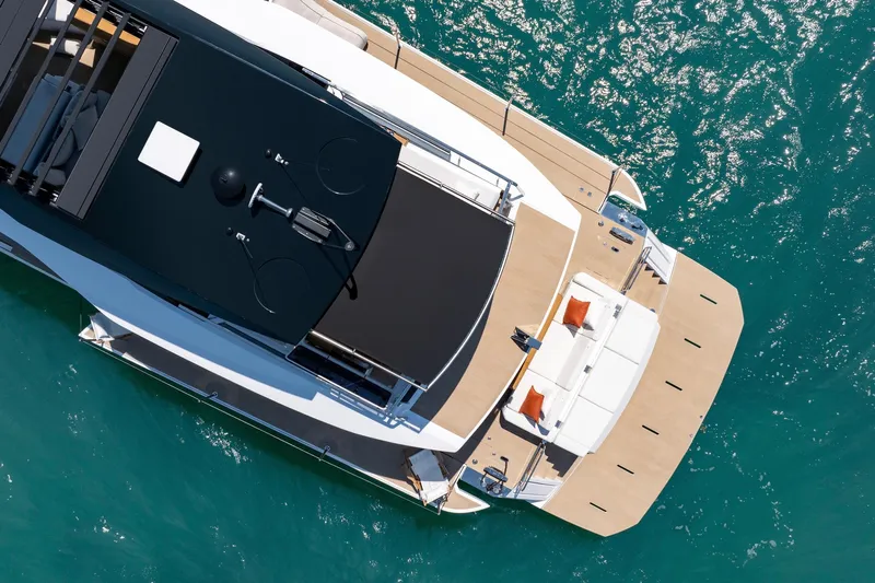  Yacht Photos Pics Aerial view of 2026 Pardo Yachts E72 luxury yacht on turquoise water.