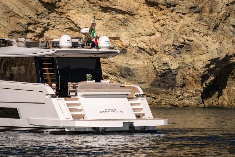  Yacht Photos Pics 2026 Pardo Yachts E72 luxury yacht cruising near rocky coastline.