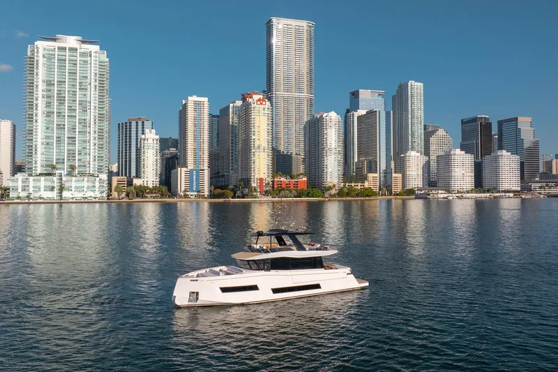  Yacht Photos Pics Luxury 2026 Pardo Yachts E72 cruising near modern city skyline.