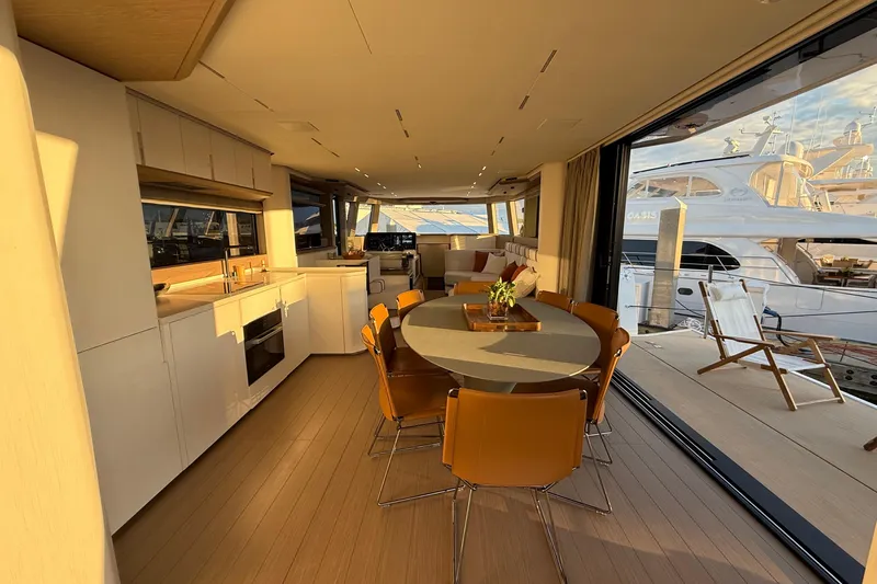  Yacht Photos Pics Luxurious interior of 2026 Pardo Yachts E72 with modern kitchen and dining area.