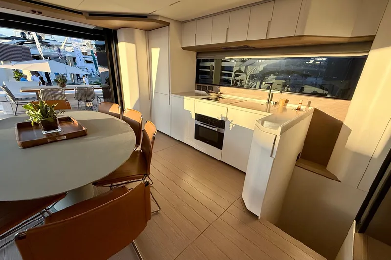  Yacht Photos Pics Luxurious interior of 2026 Pardo Yachts E72 with modern kitchen and dining area.