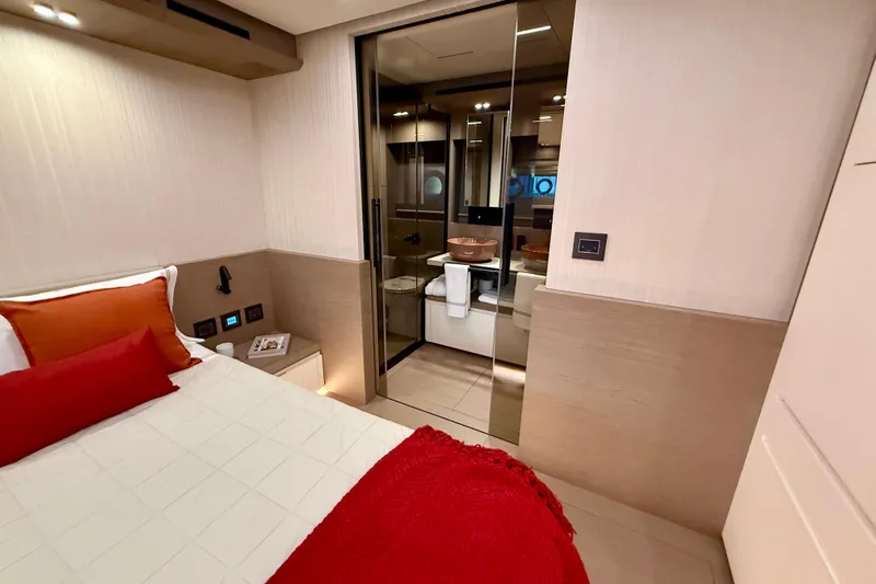  Yacht Photos Pics Luxurious interior of 2026 Pardo Yachts E72, featuring elegant bedroom and modern ensuite bathroom.