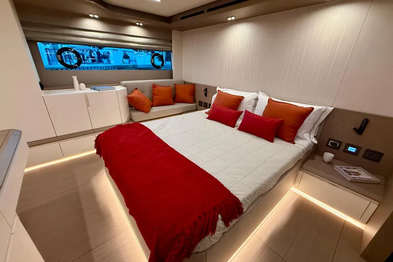  Yacht Photos Pics Luxurious bedroom interior of 2026 Pardo Yachts E72 with modern design and red accents.