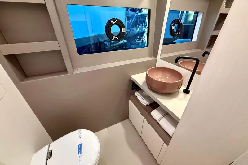  Yacht Photos Pics Luxurious bathroom interior of 2026 Pardo Yachts E72, featuring modern sink and window view.