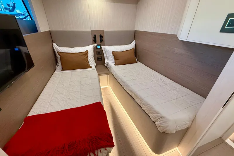  Yacht Photos Pics Luxurious twin cabin interior of 2026 Pardo Yachts E72 with modern design and ambient lighting.