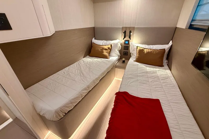  Yacht Photos Pics Luxurious twin cabin interior of 2026 Pardo Yachts E72 with modern design and cozy bedding.