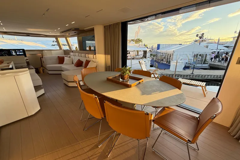  Yacht Photos Pics Luxurious interior of 2026 Pardo Yachts E72 with elegant dining area and scenic marina view.