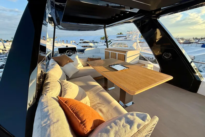  Yacht Photos Pics Luxurious interior of 2026 Pardo Yachts E72 with elegant seating and wooden table.