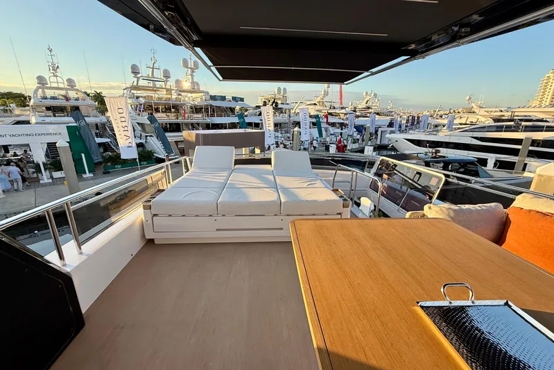  Yacht Photos Pics Luxurious 2026 Pardo Yachts E72 deck with sun loungers and table at a yacht show.
