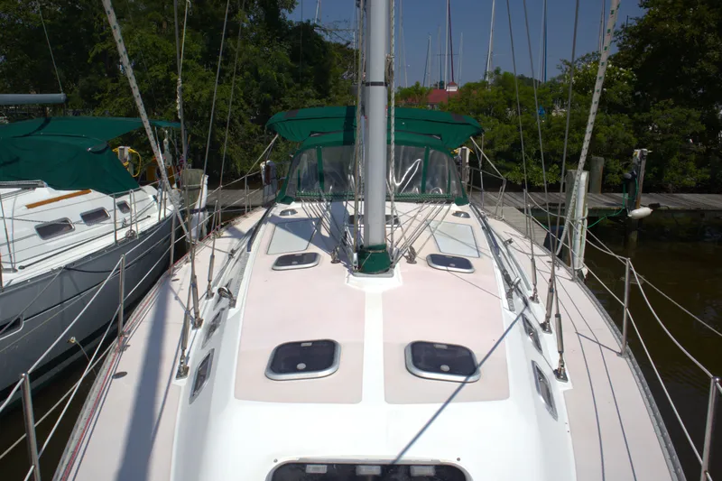 Immunity Yacht Photos Pics Sailboat Catalina 400, 1996 model, docked with green canopy and clear sky.
