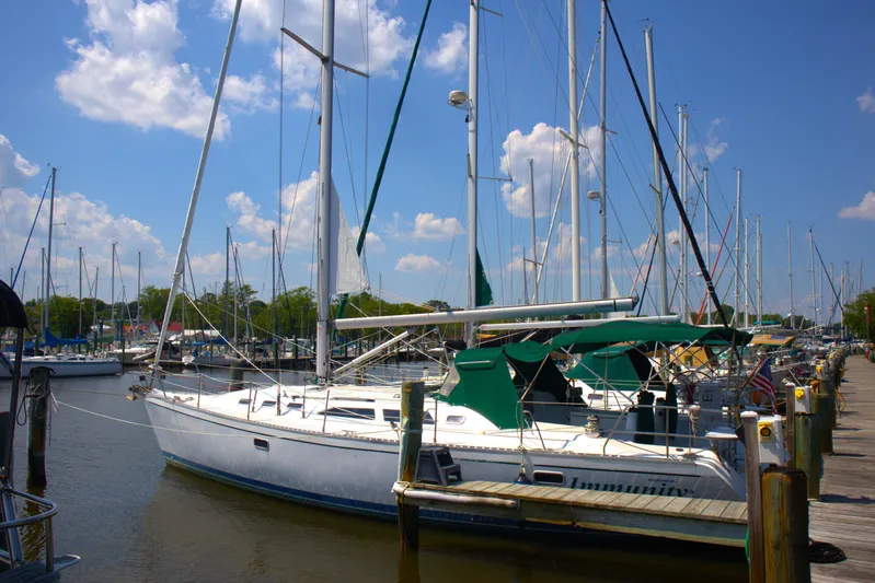 Immunity Yacht Photos Pics Sailboat Catalina 400, 1996 model, docked at marina under blue sky.