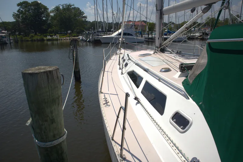 Immunity Yacht Photos Pics Sailboat Catalina 400, 1996 model, docked at a marina with green canopy.