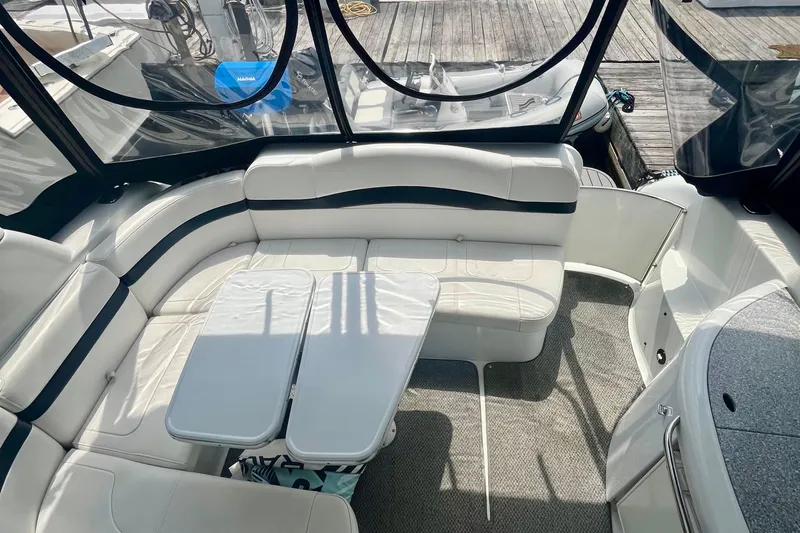 Talitoo Yacht Photos Pics 2006 Formula 37 PC yacht interior with white seating and table, docked at marina.