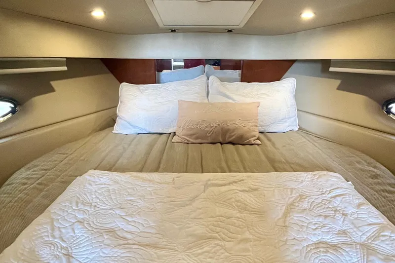 Talitoo Yacht Photos Pics Luxurious cabin interior of a 2006 Formula 37 PC yacht with cozy bedding.