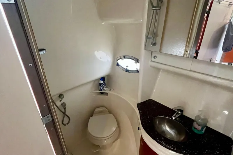 Talitoo Yacht Photos Pics 2006 Formula 37 PC yacht bathroom with toilet, sink, and small window.