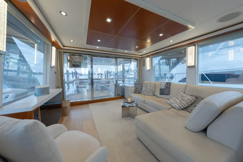 Whistle Yacht Photos Pics Luxurious interior of 2012 Lazzara Breeze yacht with elegant seating and panoramic windows.