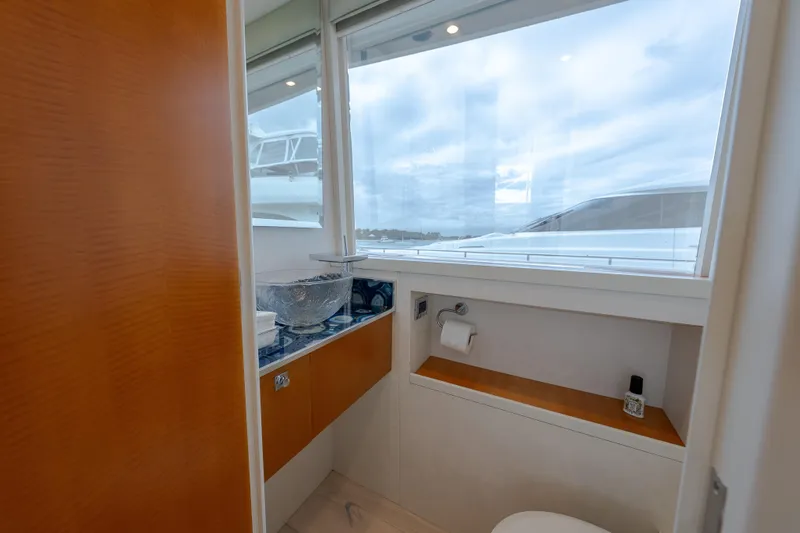 Whistle Yacht Photos Pics Luxurious bathroom on 2012 Lazzara Breeze yacht with modern fixtures and ocean view.