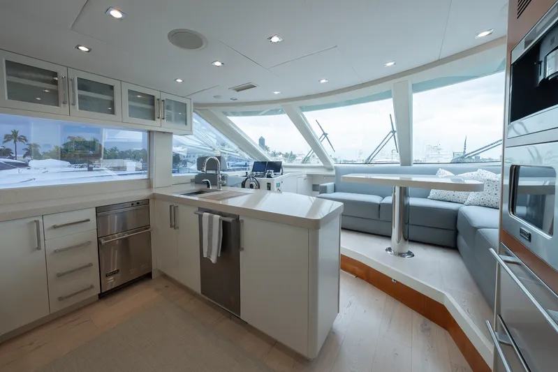 Whistle Yacht Photos Pics Luxurious 2012 Lazzara Breeze yacht interior with modern kitchen and panoramic windows.