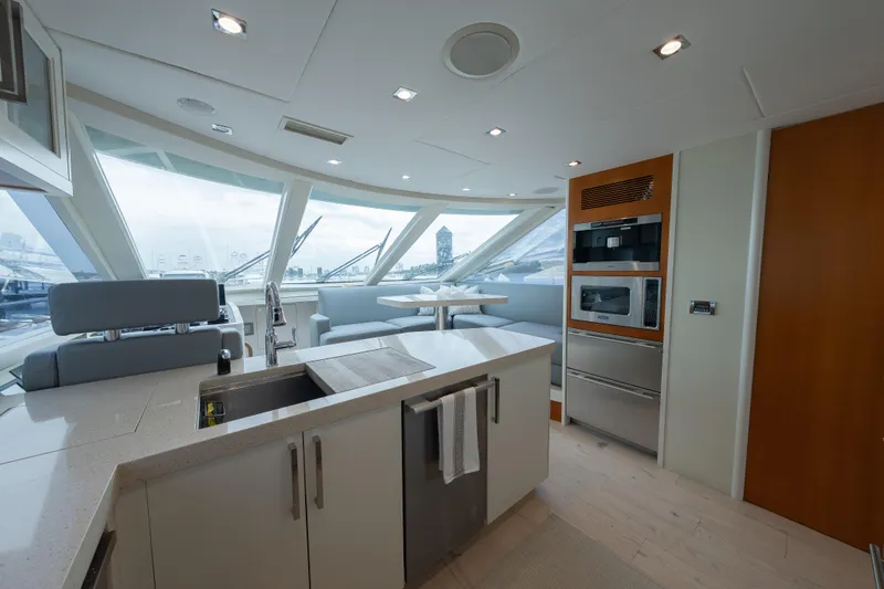 Whistle Yacht Photos Pics Luxurious 2012 Lazzara Breeze yacht interior with modern kitchen and panoramic windows.