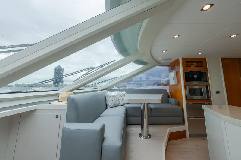 Whistle Yacht Photos Pics Luxurious interior of 2012 Lazzara Breeze yacht with modern seating and panoramic windows.