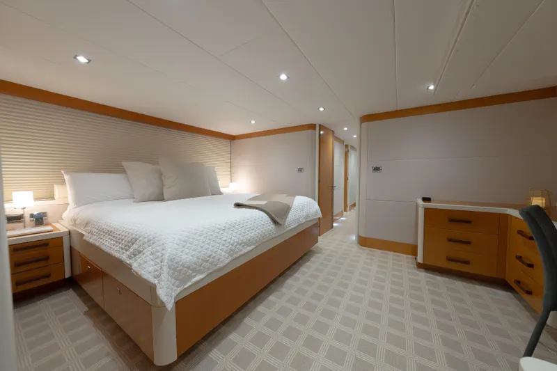 Whistle Yacht Photos Pics Luxurious bedroom interior of 2012 Lazzara Breeze yacht with modern design and cozy ambiance.
