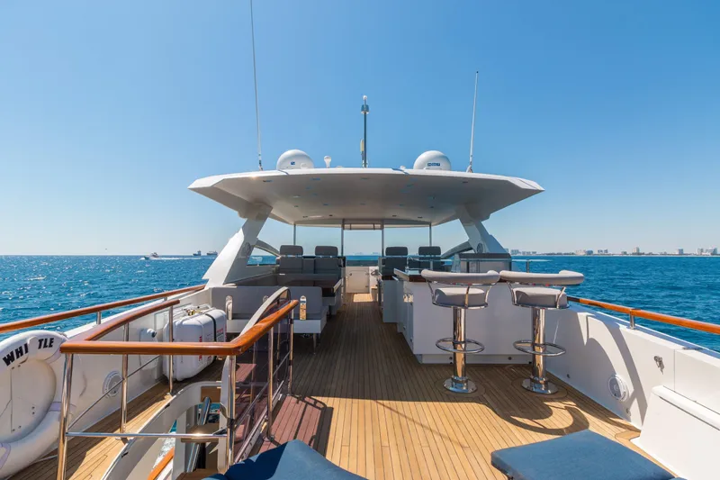 Whistle Yacht Photos Pics Luxurious 2012 Lazzara Breeze yacht deck with ocean view and seating area.