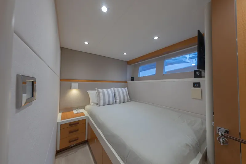 Whistle Yacht Photos Pics Luxurious cabin interior of 2012 Lazzara Breeze yacht with modern design and cozy bedding.