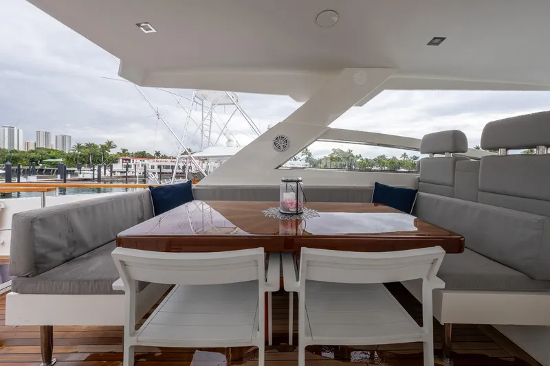 Whistle Yacht Photos Pics Luxurious 2012 Lazzara Breeze yacht deck with elegant seating and dining area.