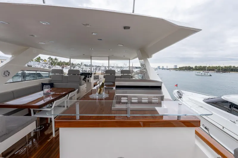 Whistle Yacht Photos Pics Luxurious 2012 Lazzara Breeze yacht deck with seating and ocean view.