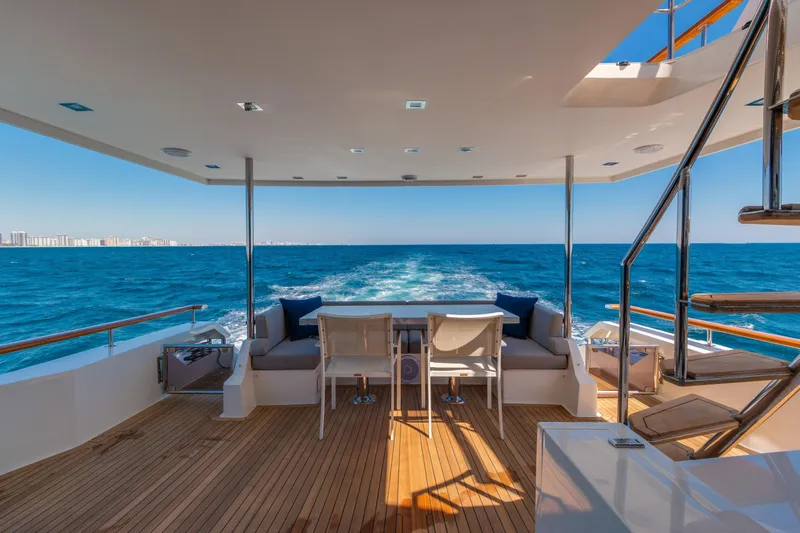 Whistle Yacht Photos Pics Luxurious 2012 Lazzara Breeze yacht deck with ocean view and modern seating area.