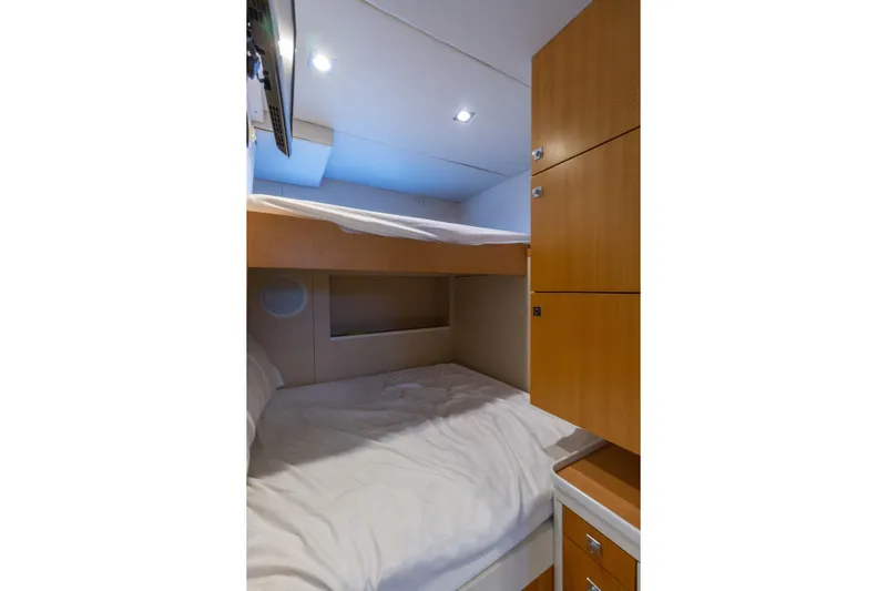 Whistle Yacht Photos Pics 2012 Lazzara Breeze yacht cabin with bunk beds and wooden cabinetry.
