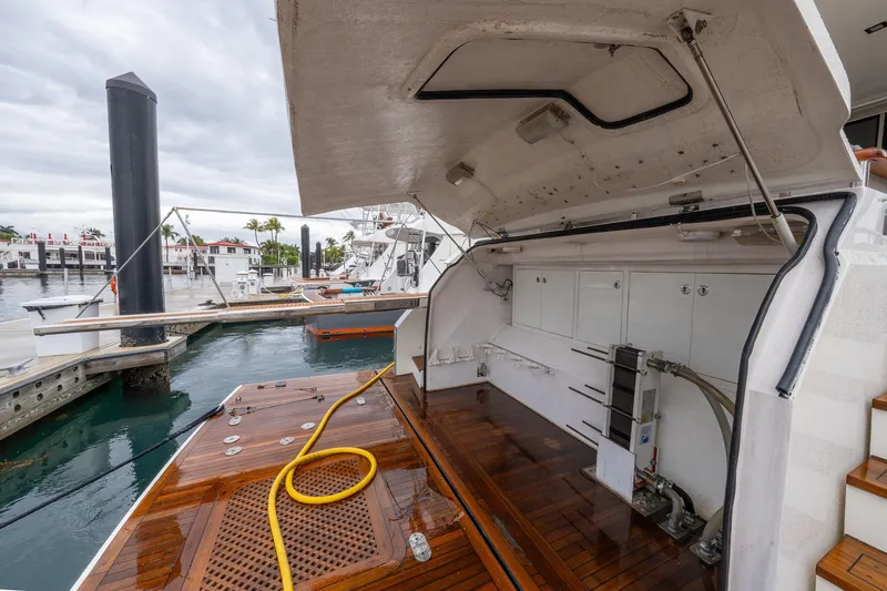 Whistle Yacht Photos Pics 2012 Lazzara Breeze yacht with open engine compartment at marina dock.