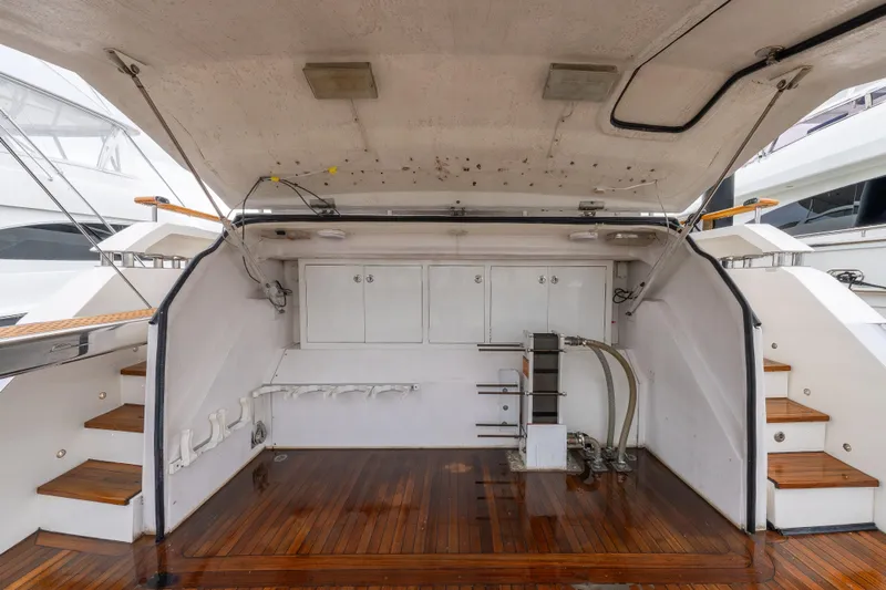 Whistle Yacht Photos Pics 2012 Lazzara Breeze yacht interior with wooden flooring and storage compartments.