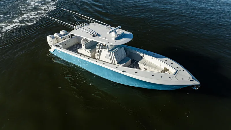  Yacht Photos Pics 2020 SeaVee 370z boat cruising on open water, featuring a sleek blue and white design.